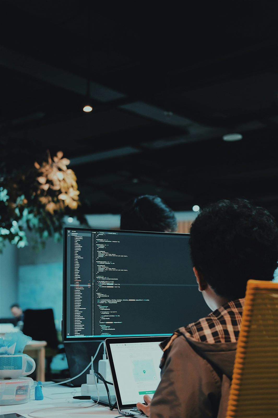 Software developer working at a desktop computer